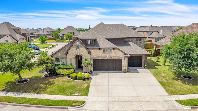 1001 Middleton St, Forney, TX 75126 - french country home with stone siding, a shingled roof, a residential view, and concrete driveway