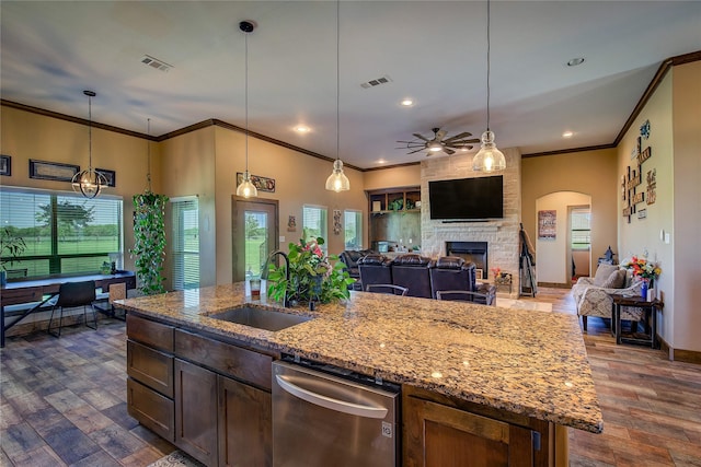 kitchen with dishwasher, ceiling fan, a sink, and visible vents