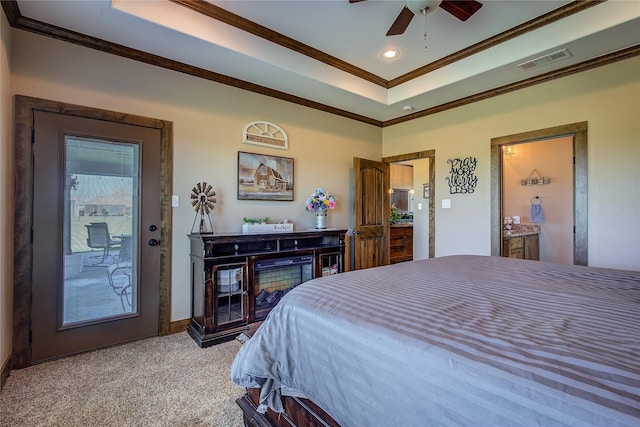 carpeted bedroom with a tray ceiling, visible vents, recessed lighting, ceiling fan, and crown molding