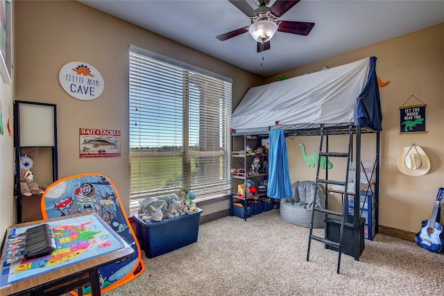 bedroom with a ceiling fan, baseboards, and carpet floors
