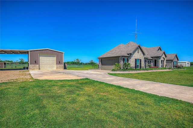 view of front of home featuring an outdoor structure, stone siding, and a front lawn