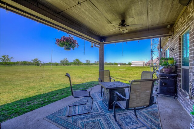 view of patio / terrace with a rural view and ceiling fan