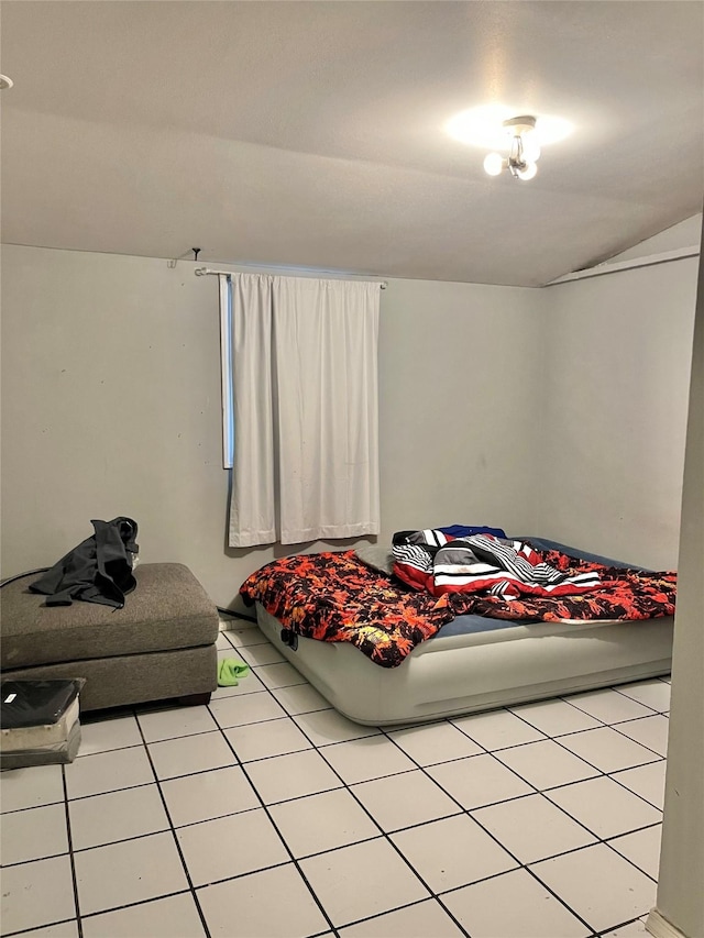 bedroom with light tile patterned flooring
