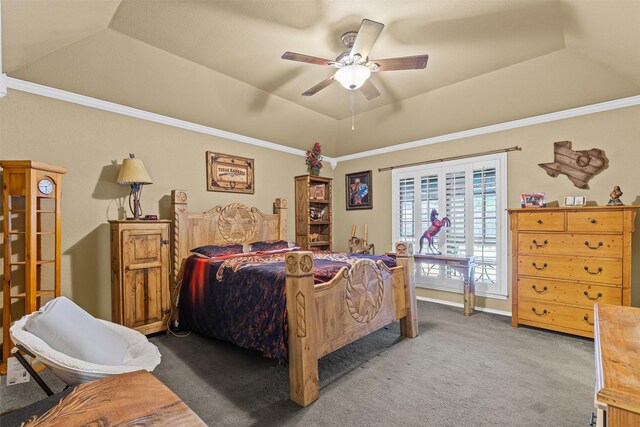 bedroom featuring a tray ceiling, crown molding, carpet flooring, and ceiling fan