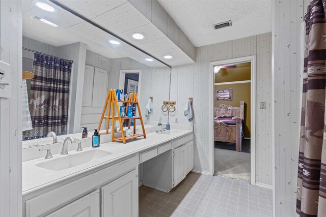 full bathroom with visible vents, a sink, recessed lighting, and double vanity