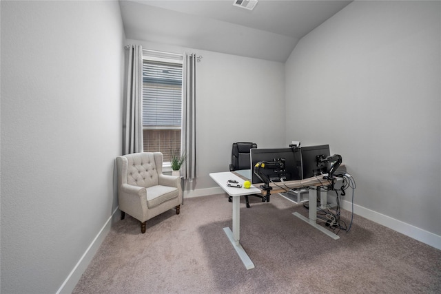 office area with vaulted ceiling, carpet flooring, visible vents, and baseboards