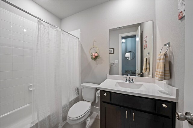 bathroom with shower / bath combo, toilet, and vanity
