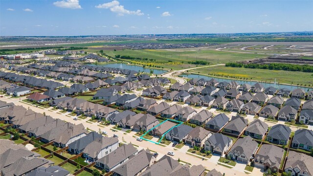 bird's eye view featuring a residential view and a water view