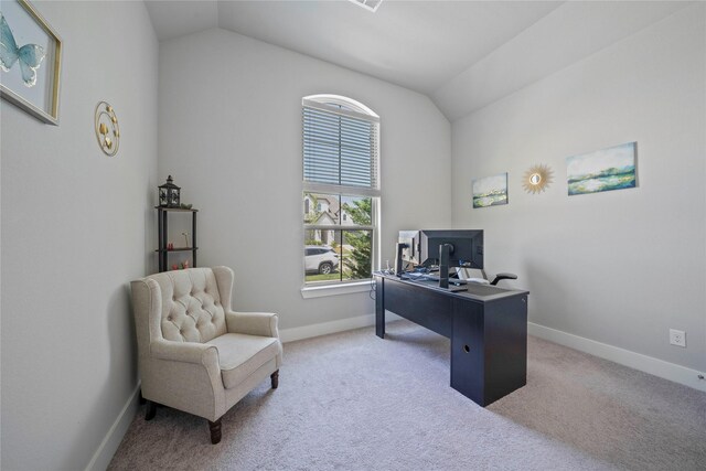 office with light colored carpet, lofted ceiling, and baseboards