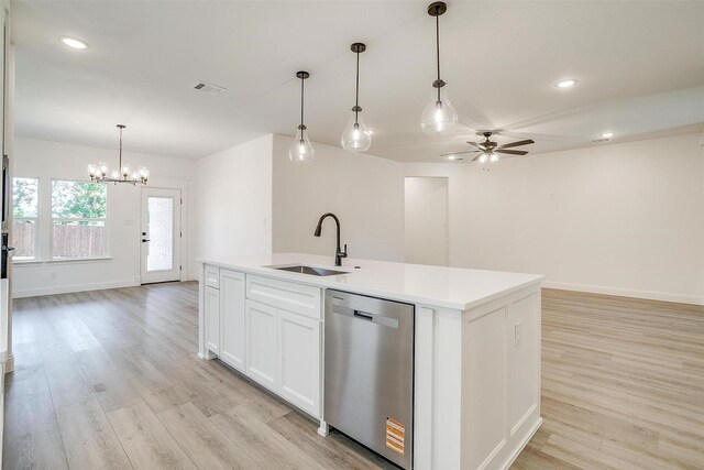 kitchen featuring dishwasher, visible vents, light wood-type flooring, and a sink