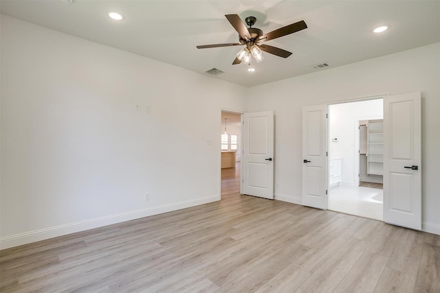 unfurnished bedroom with recessed lighting, visible vents, light wood finished floors, and baseboards