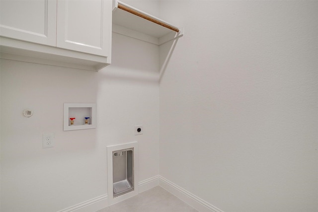 washroom with hookup for an electric dryer, baseboards, hookup for a washing machine, cabinet space, and gas dryer hookup