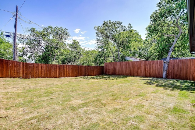 view of yard with a fenced backyard