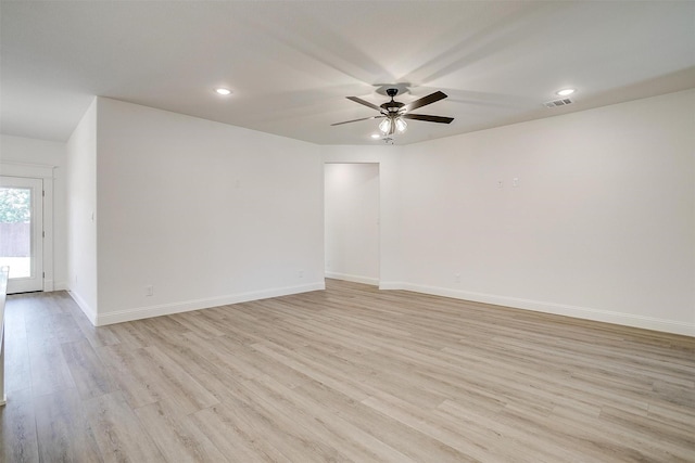unfurnished room with baseboards, visible vents, recessed lighting, light wood-style floors, and ceiling fan