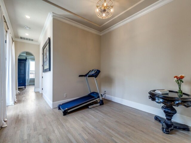 bedroom with vaulted ceiling, light wood-style flooring, baseboards, and multiple windows