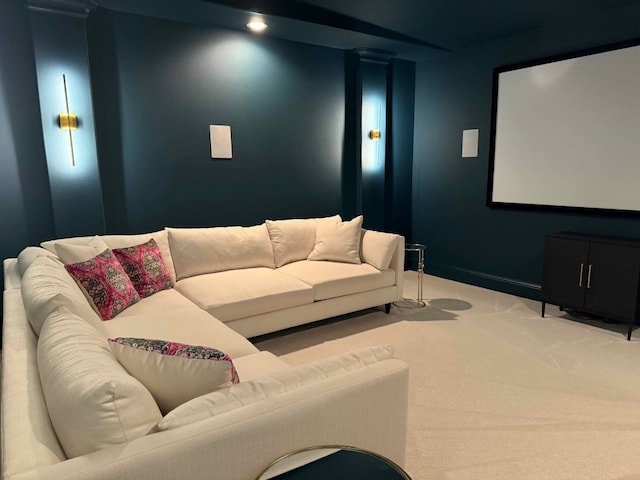 cinema room featuring baseboards and carpet floors