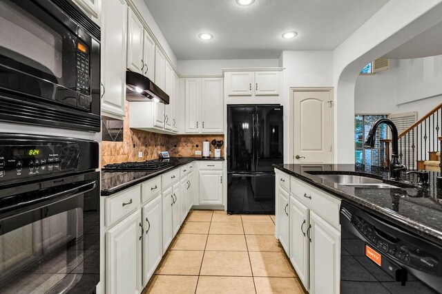 14208 Rising Star Blvd, Frisco, TX 75033 - kitchen with black appliances, a sink, under cabinet range hood, white cabinets, and backsplash