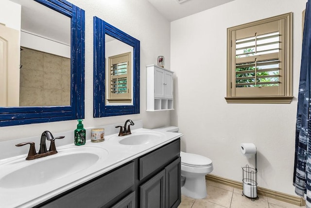 14208 Rising Star Blvd, Frisco, TX 75033 - bathroom with tile patterned flooring, double vanity, toilet, and baseboards
