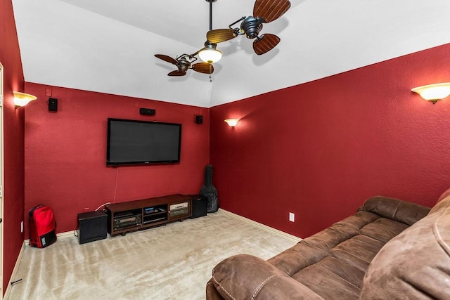 cinema room with baseboards, a ceiling fan, carpet, and vaulted ceiling
