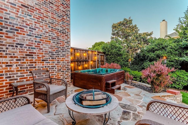 14208 Rising Star Blvd, Frisco, TX 75033 - view of patio with an outdoor fire pit and a hot tub