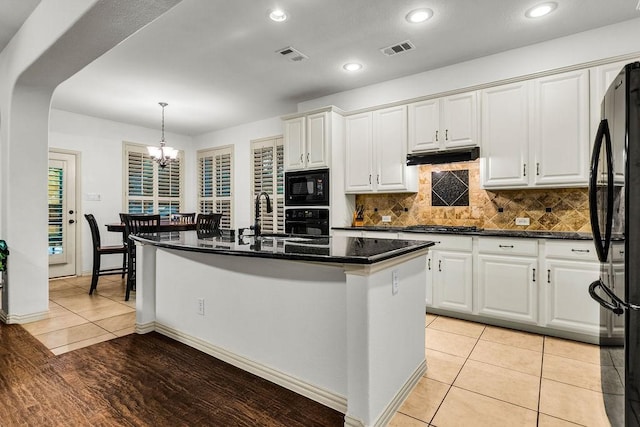 14208 Rising Star Blvd, Frisco, TX 75033 - kitchen with black appliances, a sink, white cabinets, a chandelier, and recessed lighting