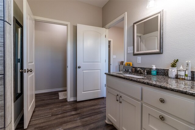 bathroom featuring vanity and wood finished floors