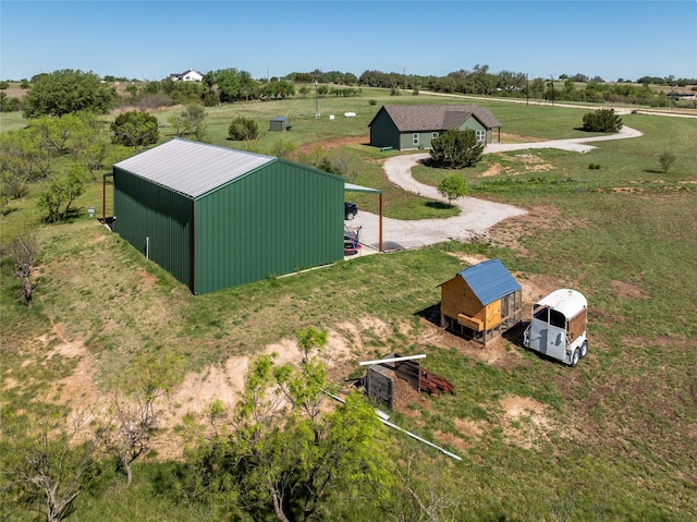 birds eye view of property with a rural view