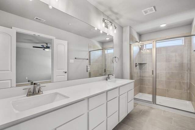 bathroom with visible vents, a sink, and a healthy amount of sunlight