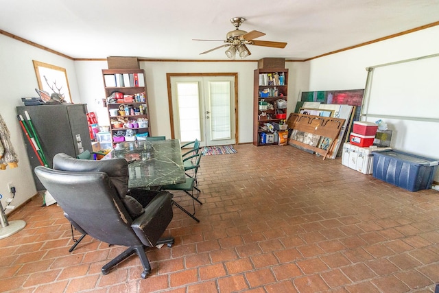 dining room with ceiling fan and crown molding