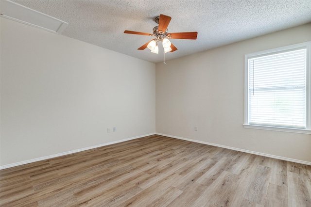 4504 Courtside Dr, Mckinney, TX 75070 - empty room featuring light wood-style flooring, ceiling fan, baseboards, and a textured ceiling