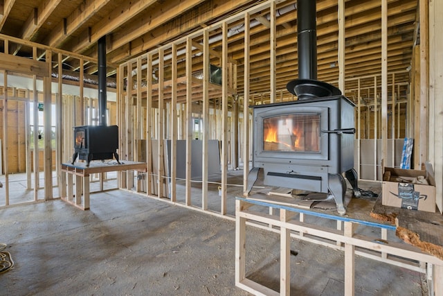 misc room with a wood stove