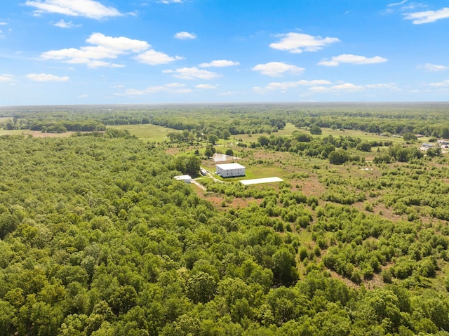 bird's eye view featuring a wooded view