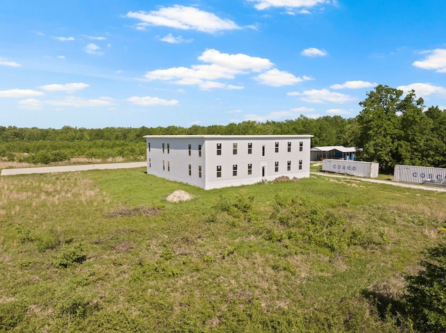 view of side of property with a yard