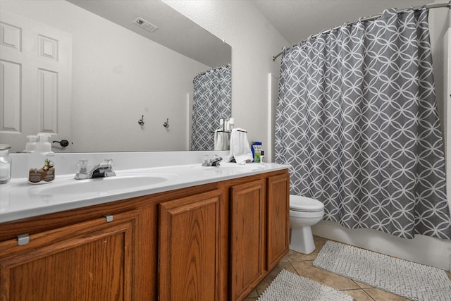 405 Londonderry Ln, Mansfield, TX 76063 - full bathroom with tile patterned flooring, visible vents, a sink, and toilet