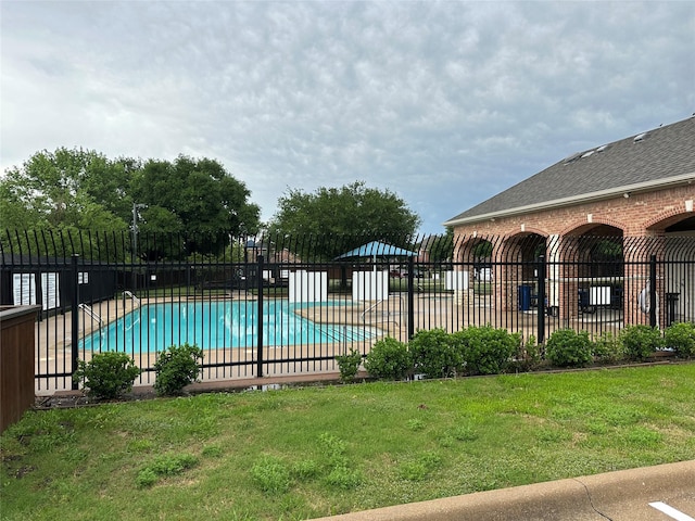 405 Londonderry Ln, Mansfield, TX 76063 - community pool featuring a lawn and fence