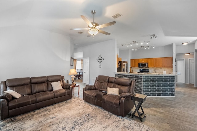 405 Londonderry Ln, Mansfield, TX 76063 - living area featuring ceiling fan, lofted ceiling, wood finished floors, and visible vents