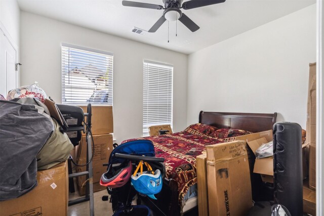 bedroom featuring a ceiling fan and visible vents