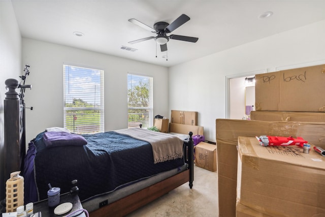 bedroom with a ceiling fan, visible vents, and light colored carpet