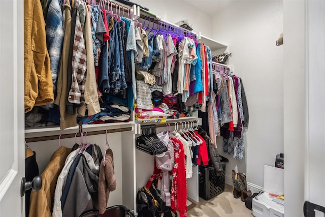 spacious closet with carpet flooring