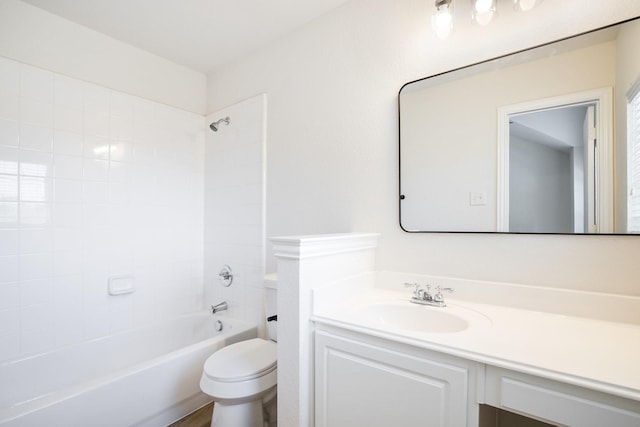 full bath featuring toilet, vanity, and washtub / shower combination