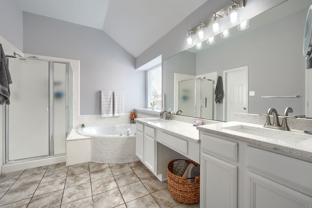 full bathroom featuring a bath, a sink, a shower stall, and lofted ceiling