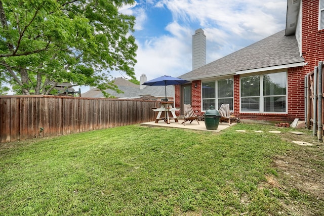 view of yard featuring a patio and a fenced backyard