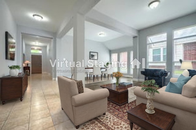 living area with light tile patterned flooring and lofted ceiling
