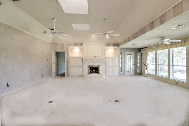 unfurnished living room with a ceiling fan, light carpet, a brick fireplace, visible vents, and recessed lighting