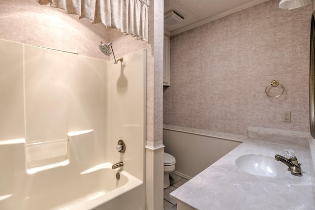 bathroom featuring crown molding, shower / bathtub combination, vanity, and toilet