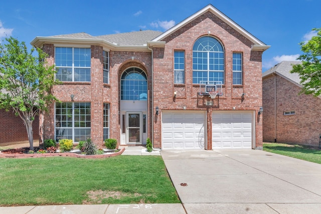 view of front of home featuring a front lawn, driveway, brick siding, an attached garage, and a shingled roof