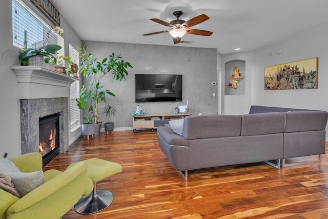 living area with visible vents, recessed lighting, wood finished floors, ceiling fan, and a fireplace