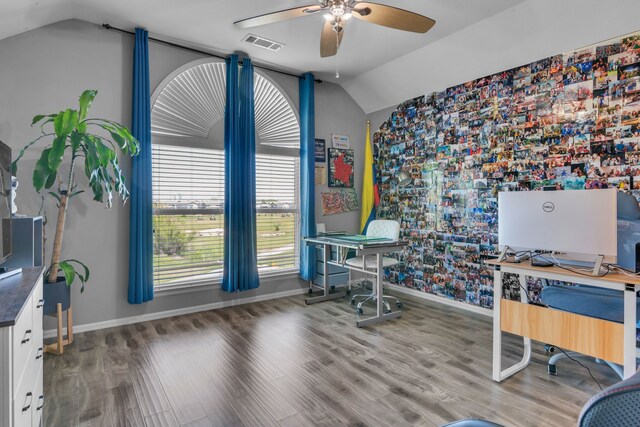 office area featuring baseboards, vaulted ceiling, visible vents, and ceiling fan