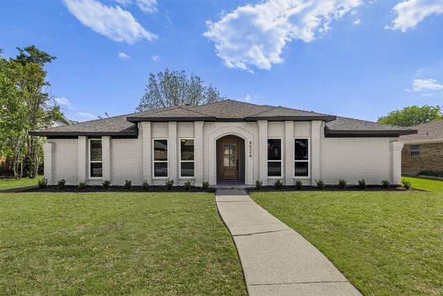 4524 Boston Dr, Plano, TX 75093 - prairie-style house with a front yard and brick siding