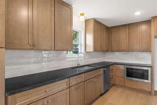 4524 Boston Dr, Plano, TX 75093 - kitchen featuring decorative backsplash, stainless steel dishwasher, built in microwave, light wood-type flooring, and a sink